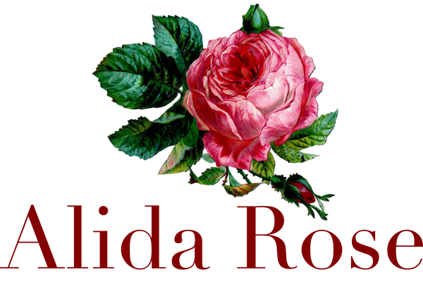Pink rose with green leaves and 'Alida Rose' text on a white background